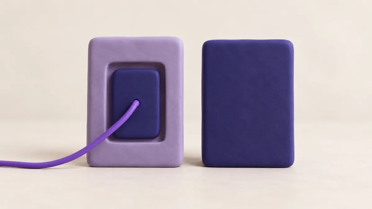 Clay still life: a lavender frame holding a smaller card wired to something off-frame, beside a single solid indigo card, like a shared post next to a new one