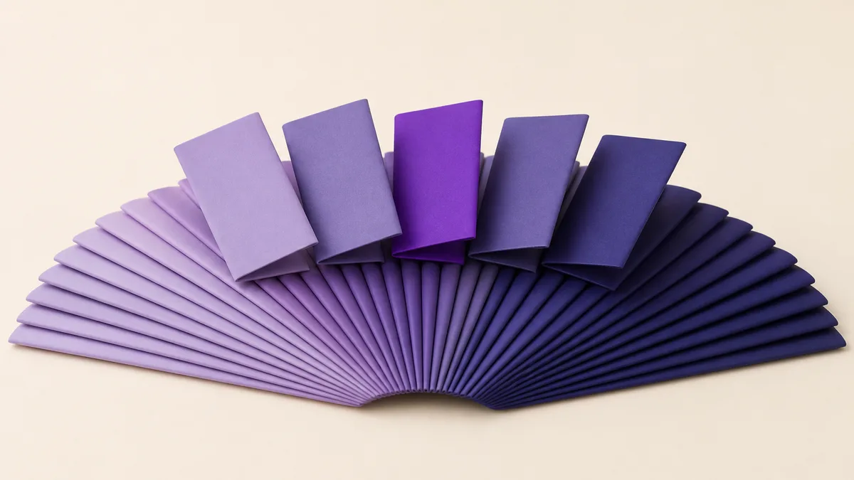 A fan of folded notes with five turned to face the viewer, the rest lying flat — choosing a saved group list