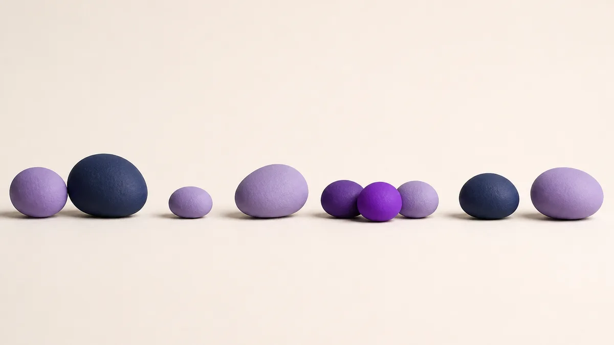 Smooth pebbles laid along a line at deliberately uneven distances — randomised gaps between posts, not a fixed interval