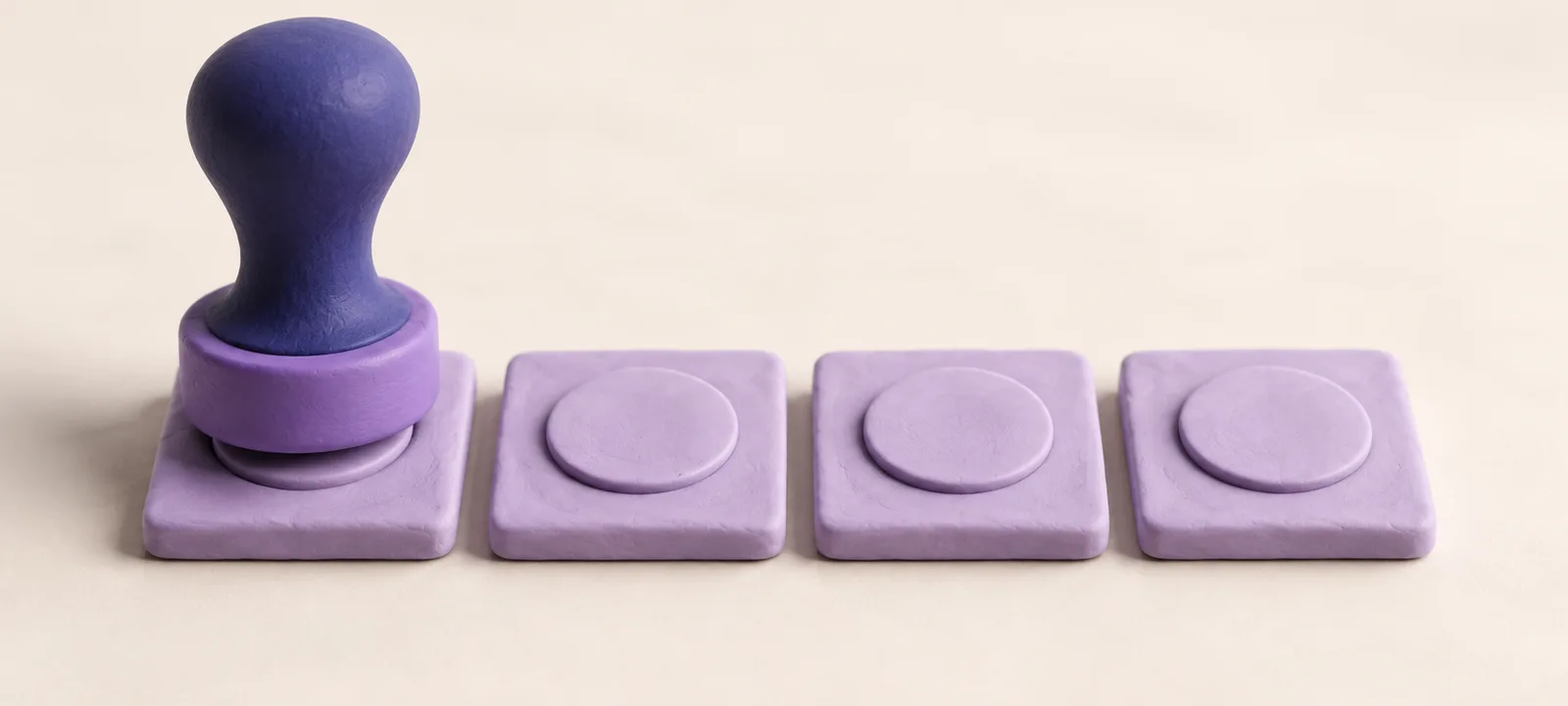A clay stamp pressing the first of four blank clay tiles in a row, the other three already carrying the same round imprint, lavender and indigo